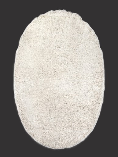 Oval white shaggy wool rug – side view