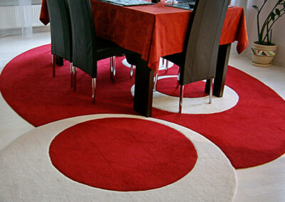 Oval contemporary rug white-red in the living room interior