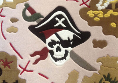 Skull & treasure chest detail on rug