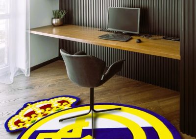 Real Madrid rug displayed in a fan’s room interior - luxury decor for true supporters