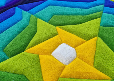 Pile detail of colorful rug — carved relief