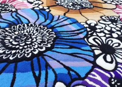 Close-up of hand-tufted abstract floral rug texture