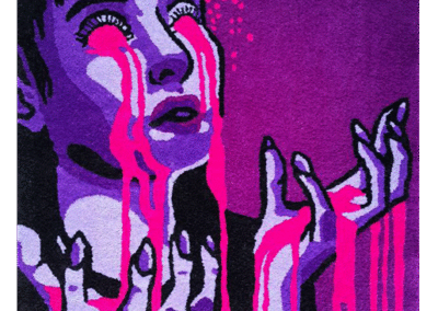 Artistic handmade rug depicting a woman with bloody tears