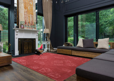 Celtic rug with terracotta texture and carved lines viewed from angle