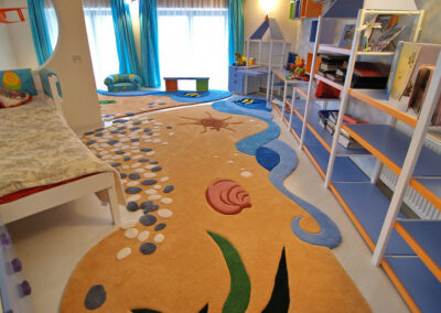 Panoramic view of custom-designed ocean rug from the sleeping corner
