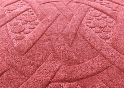 Sculptural carving detail on Celtic rug with loop and cut pile