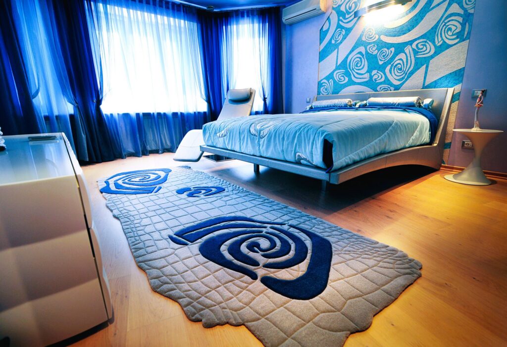 Grey blue rug with pattern and texture in bedroom interior