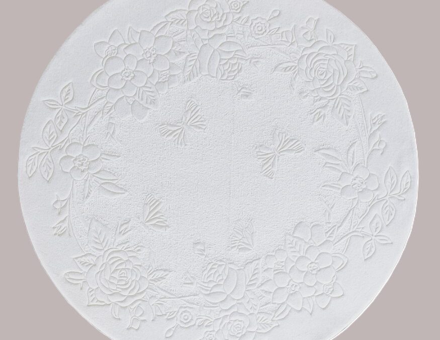 Round white carpet with two textures and relief floral pattern