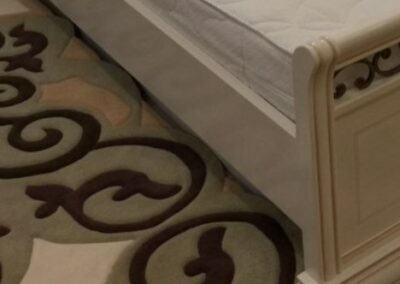 "Rug fragment with wrought iron pattern detailing"