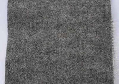 Felt fabric for the reverse side of carpet