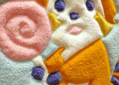 Close-up of hand-carved texture on baby rug